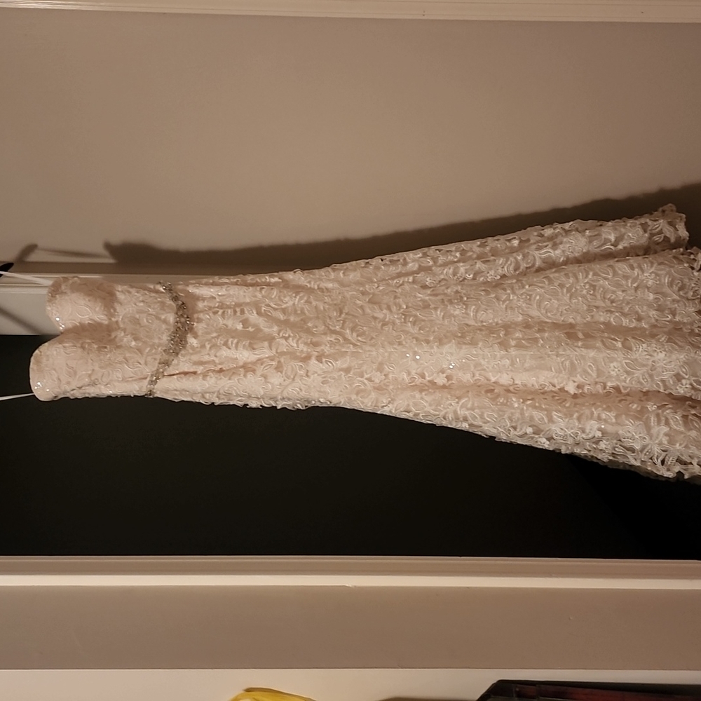 Wedding dress. Worn once. Size 6. No tears or stains.